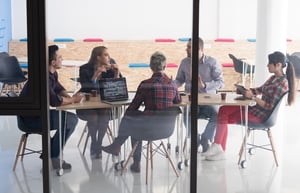 Workers around table