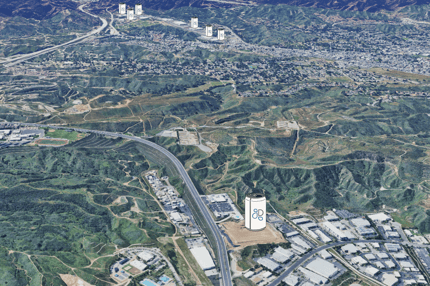 An aerial shot facing Southwest, showing the santa clarita valley, with aluminum can images with Drinkpak logos on them demarkating each of the buildings they currently operate out of
