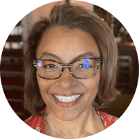 Lannice renfro headshot. woman smiling wearing glasses